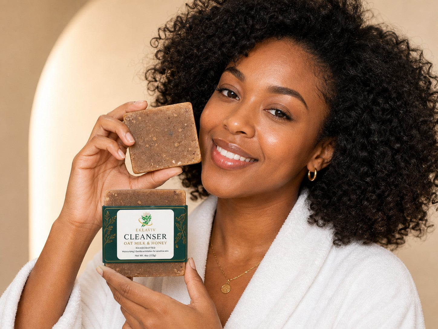 Woman holding the EKLAVIV Cleanser bar to her cheek